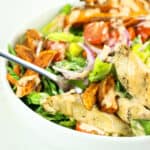 Salad bowls with sweet potatoes, chicken, and chipotle dressing.