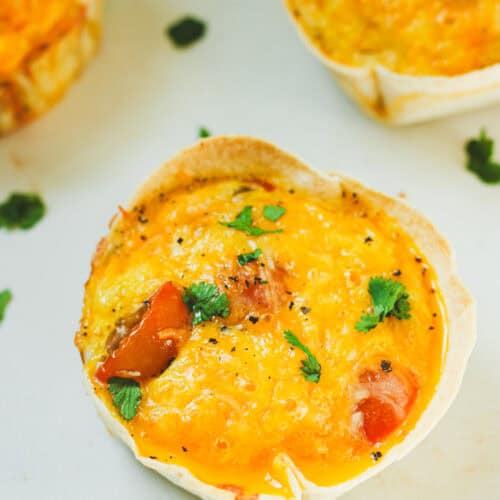 Tortilla egg quiche recipe made with eggs, cottage cheese, sausage, and cheese. High protein breakfast idea.